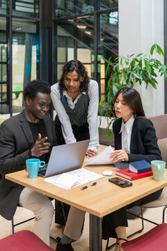 Multiracial Team Collaboration At Desk