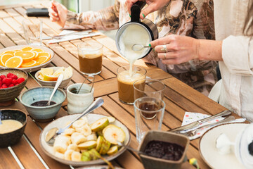 Friends Enjoying Brunch on Home Terrace