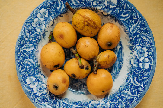 Top view of loquat fruits on a plate