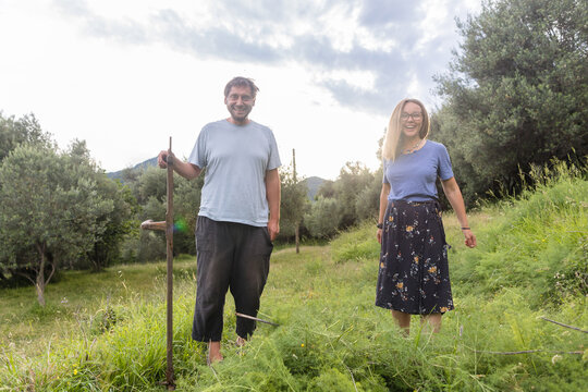 Woman and man on the hayfield