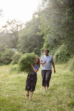 Villagers going back from hayfield