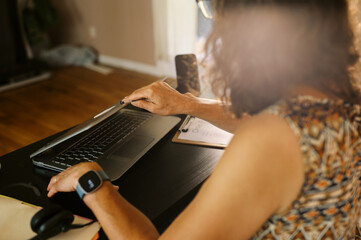 middle aged worker at home at desk in her office