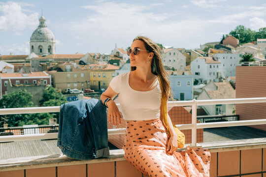 Female tourist in Lisbon during sunny summer day