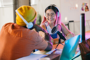 Podcast hosts discussing topics with microphones and headsets on