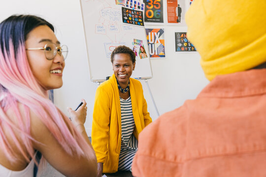 Creative collaborative meeting with diverse team in modern office