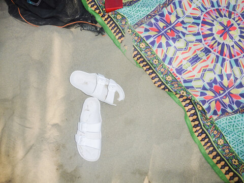 Sandals on Colorful Beach Mat