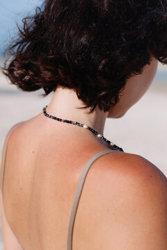 Crop woman with burned tanned red skin on shoulders 