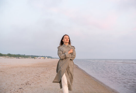 Woman Walking At Seashore
