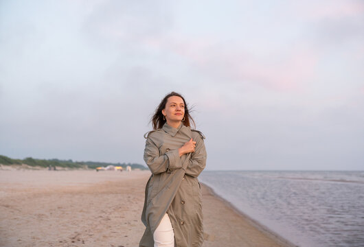 Woman Walking At The Beach