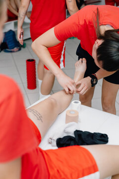 Girl Athletes Preparing For a Football Match