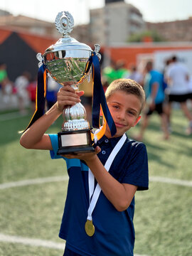 Kid Holding Trophy