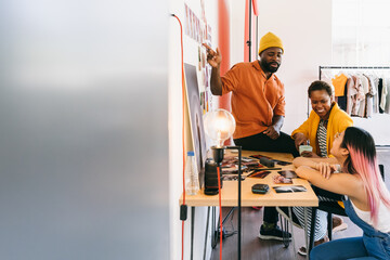 Creative team brainstorming ideas in modern office environment