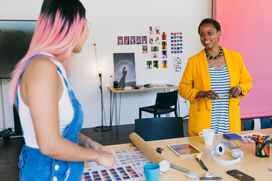 Creative collaboration in modern office with colorful tools - Powered by Adobe