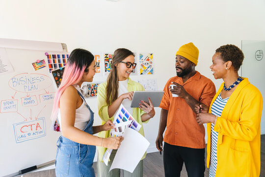 Collaborative multi-ethnic creative team discussion