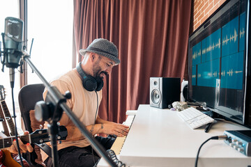 composer composing a melody on the computer