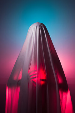 Surreal ghost holding red light in a dream
