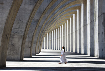 woman walking in concrete construction