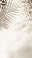 Obraz premium A soft, neutral background featuring the delicate shadows of palm leaves. The interplay of light and shadow creates a serene and tropical atmosphere, ideal for design and decor. Vertical orientation.