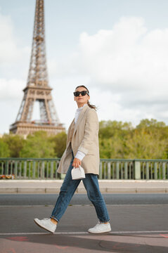 Woman walking near eiffel tower