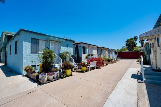 A row of small colorful homes in San Diego, CA - Powered by Adobe