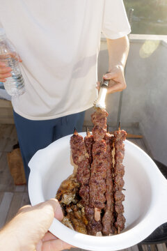 young woman grilling meat