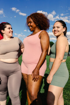 Curvy friends dressed in sportswear spend some quality time together