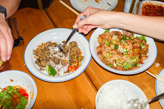 Hand Serving Spicy Thai Food