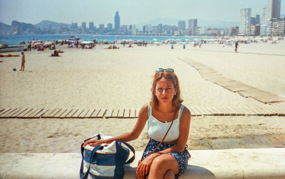 Analog portrait of a woman on the beach in Benidorm, Spain in the 90s
