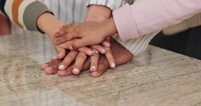 Family, stack and hands together for support in home with fun activity, unity or love on table in dining room. Closeup of parents, children or piling for protection, collaboration or bonding in house