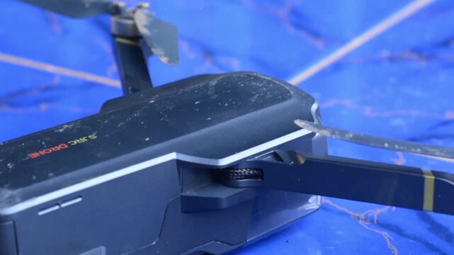 Close-up of drone propellers and brushless motor. Quadcopter blades. Drone maintenance.