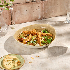 Authentic Tempura Chicken Fillet Salad with Spicy Sauce in Sun-drenched Aesthetic Setting