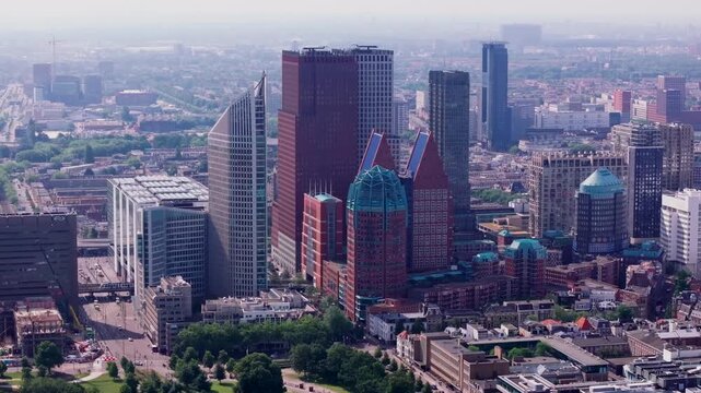 Modern skyline of The Hague at sunrise, highlighting its unique architecture including Hofturm and Zurichturm and cityscape. Travel and architectural themes