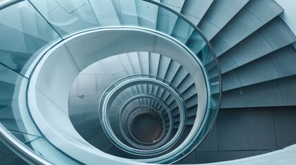 Spiral staircase inside a modern cylindrical building with glass floors