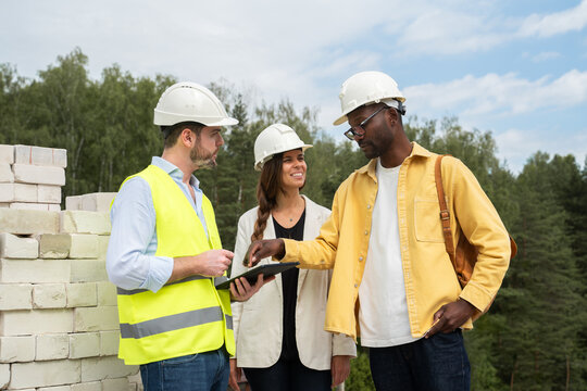 Architect And Clients Meeting At Construction Site