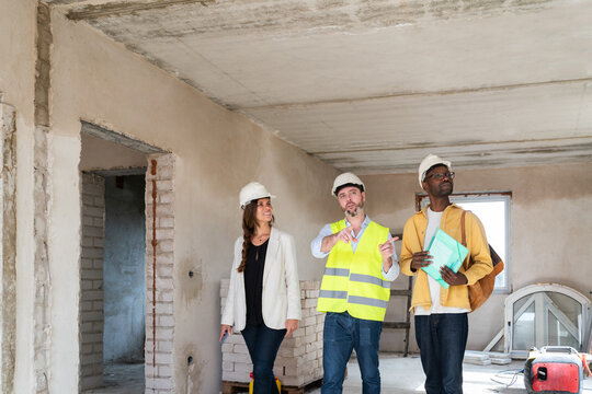 Architect Showing Construction Site To Investors