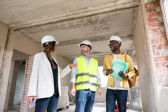Architects And Engineer Discussing Housing Project