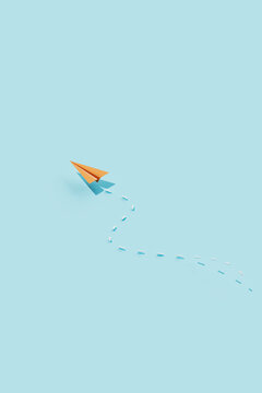 Single Orange Paper Plane with Curved Dashed Path on Blue Backgr
