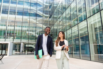 Happy Businessman And Businesswoman Outside Office
