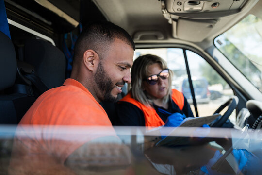 Paramedics team reviewing medical information