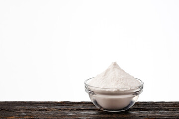 Baking soda powder in the bowl - Healthy food.