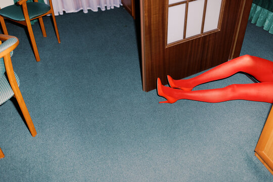 young woman wearing the red hight heels 
