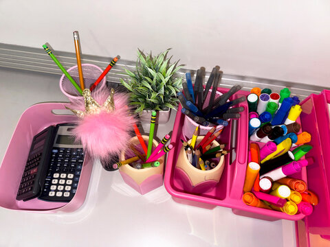 School Supplies in classroom with pink tray 