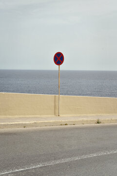 A minimalist image of a no parking traffic sign