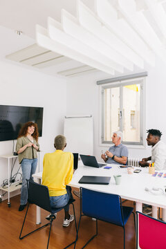 Team collaborating in modern office space for project presentation