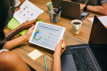 Unrecognizable people Analyzing social charts during a meeting