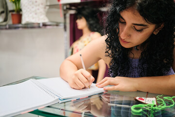 Worker taking notes in a notebook