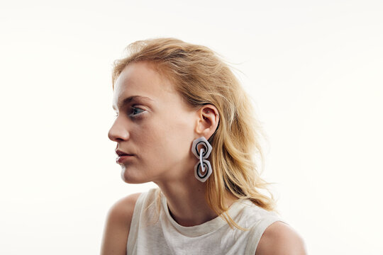 Portrait of a blonde woman wearing earrings