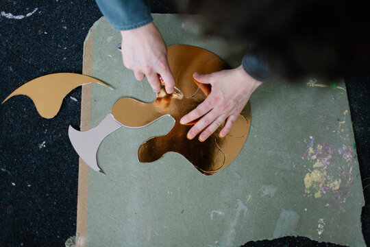 a young woman makes decorations in the workshop