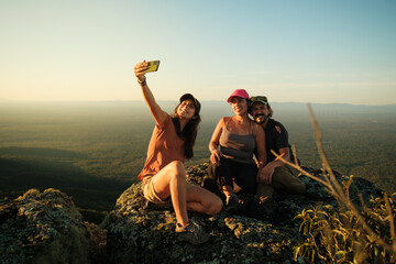 Three Friends Taking a Selfie on a Hiking Trip