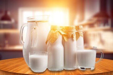 Glass and jug of fresh milk on the desk
